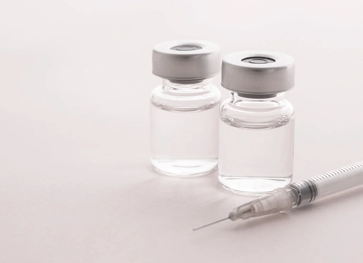 Row of aesthetic botulinum toxin vials with syringe for professional clinical injection and dosage